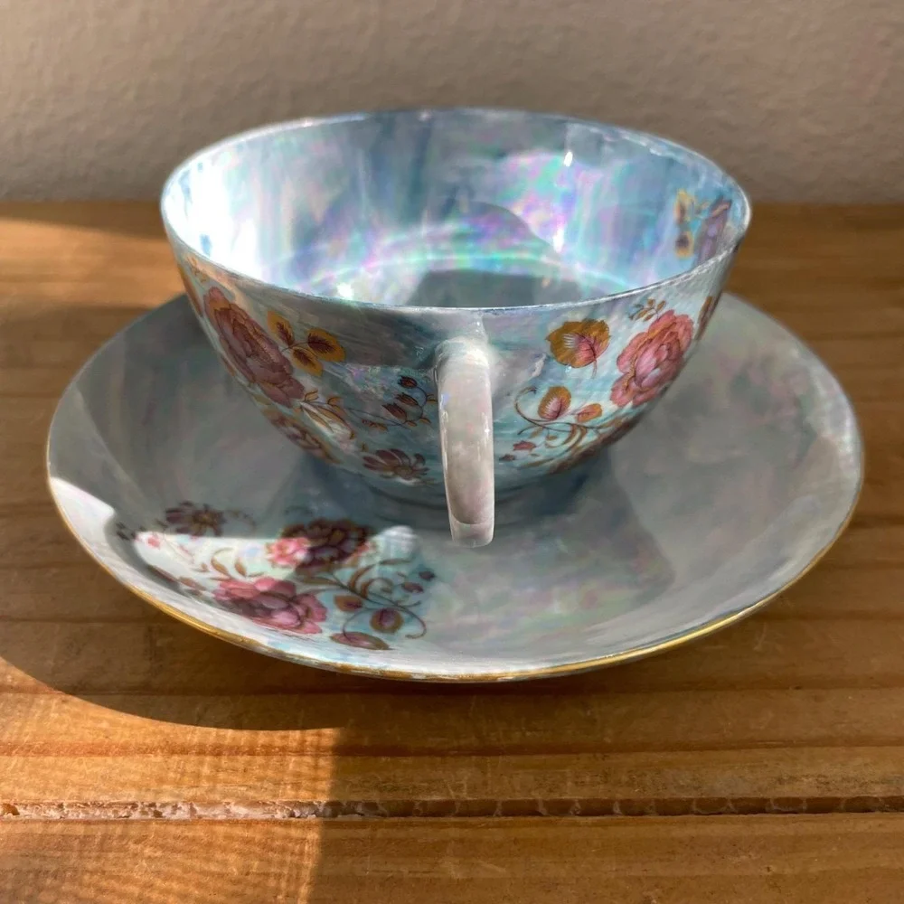 Vintage Blue Iridescent Teacup and Saucer Thomas Germany Lustreware Floral‎